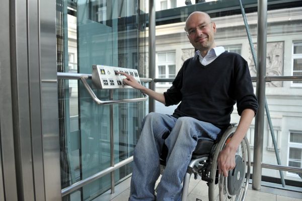 Wheelchair users in the lift 