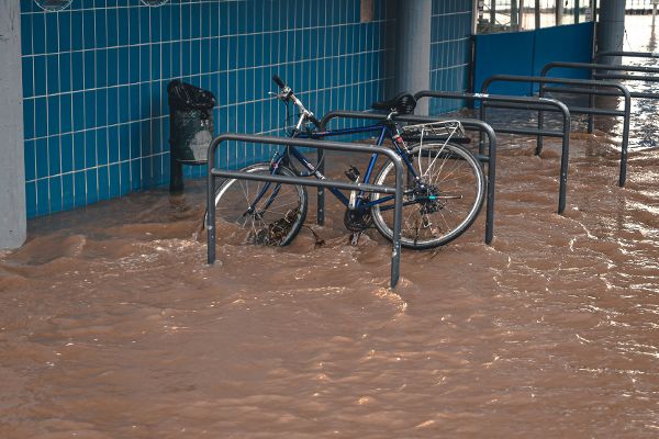 A bicycle on the bike rack during a flood.